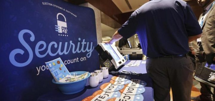 An Election Systems & Software employee demonstrated security equipment at a National Association of Secretaries of States convention in Philadelphia in July.