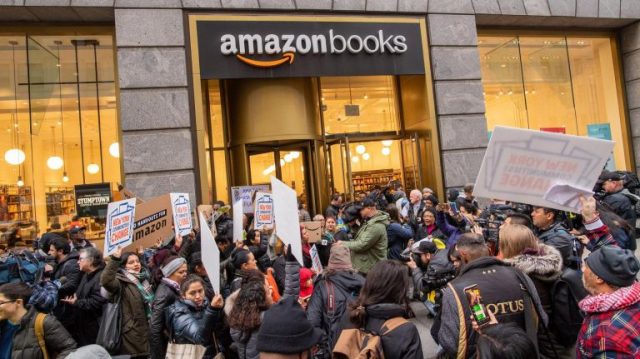 Image result for Amazon HQ2 protesters swarm Herald Square bookstore
