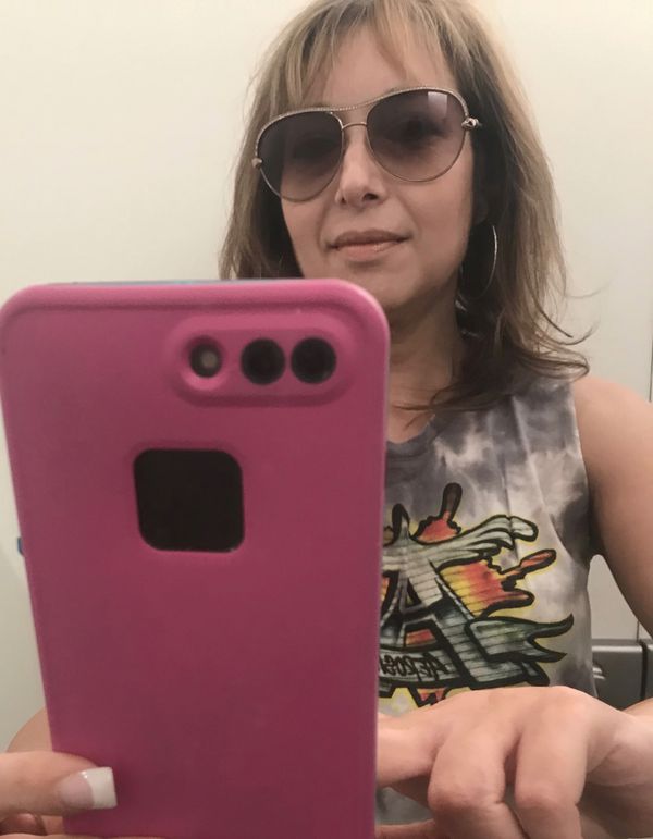We got two Tâs for -- my daughter got a Prince Purple Rain shirt (yes, sheâs an old soul) and I got an Aerosmith tank. (Selfie by Tracey Porpora)