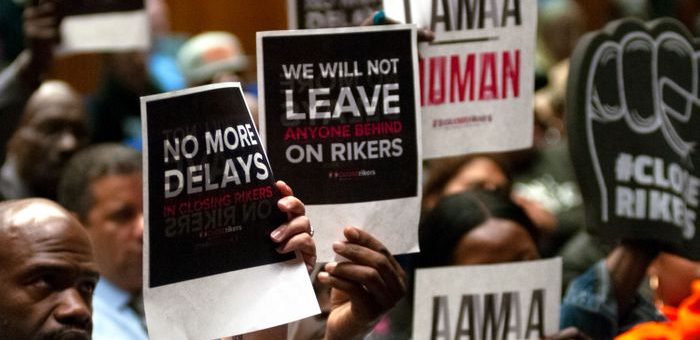 Criminal justice reform advocates demand the closing of all jails on Rikers Island during a community board meeting in The Bronx, May 23, 2019.