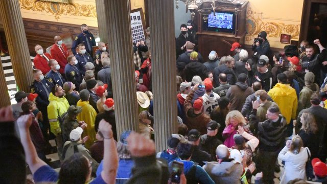 Protesters, some armed, enter Michigan Capitol