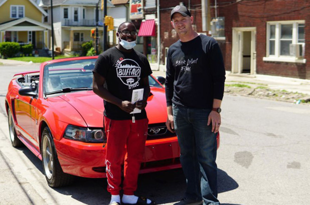 Antonio Gwynn Jr. (left) received a 2004 Mustang from Matt Block as a reward for Gwynn’s work cleaning up after protests